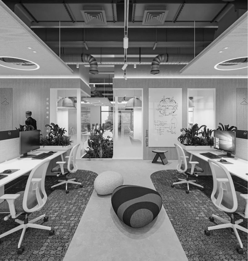 An open office with dedicated desks and meeting spaces